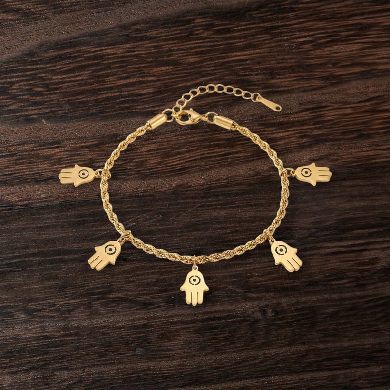 An elegant gold bracelet made of rust-resistant stainless steel, with a classic "braided" design from which five "hand of the hand" pendants dangle, with an adjustable clasp to suit you. - Image 3